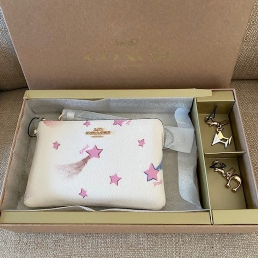 Coach corner zip wristlet with disco star print